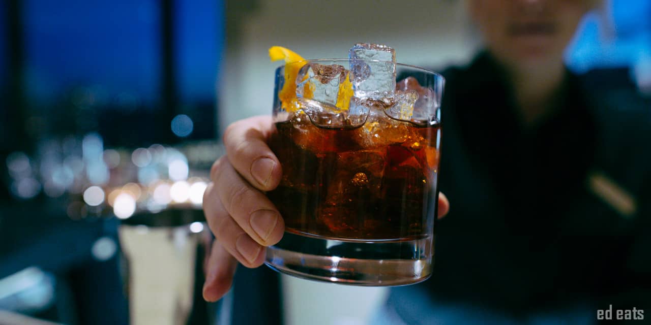 Bartender passing a drink