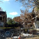 Front. One house completely missing,another one half missing