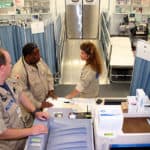 Hospital room and personnel ready for the next emergency.