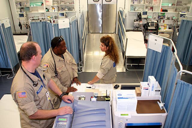 Hospital room and personnel ready for the next emergency.